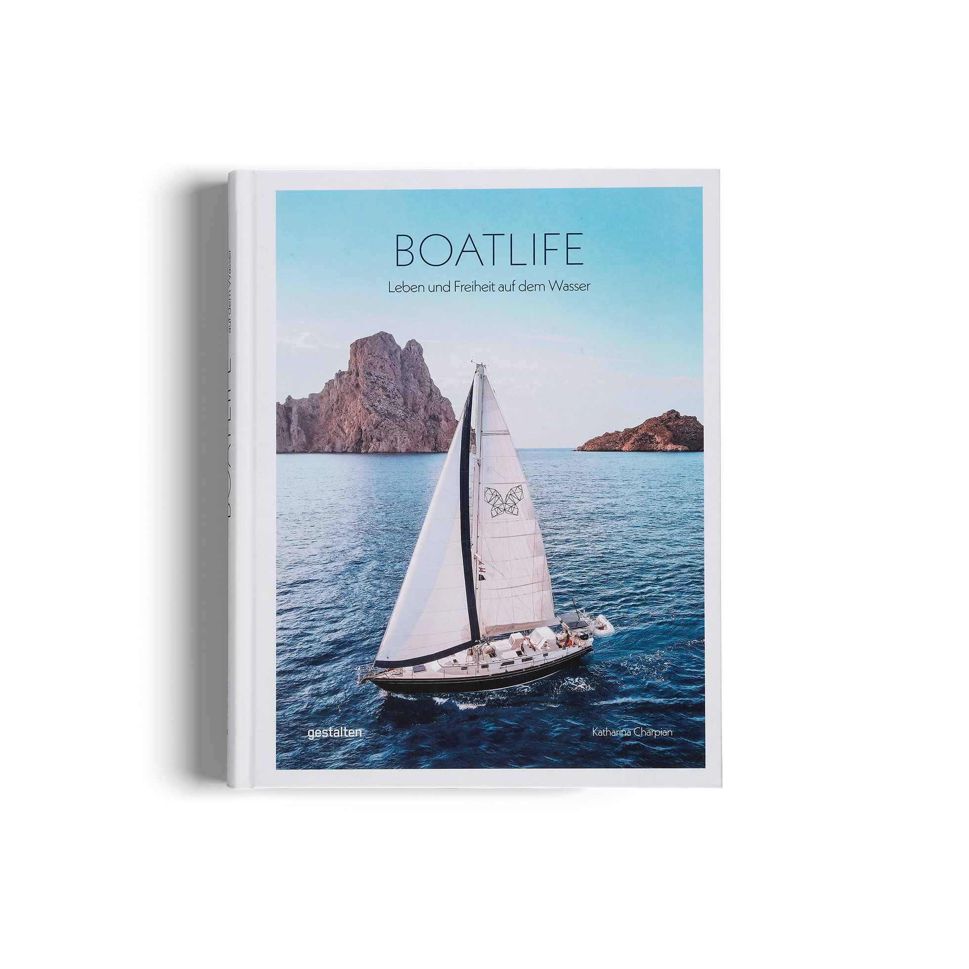 A cover image of the book titled 'BOATLIFE' showing a sailboat on open waters with a mountainous backdrop.