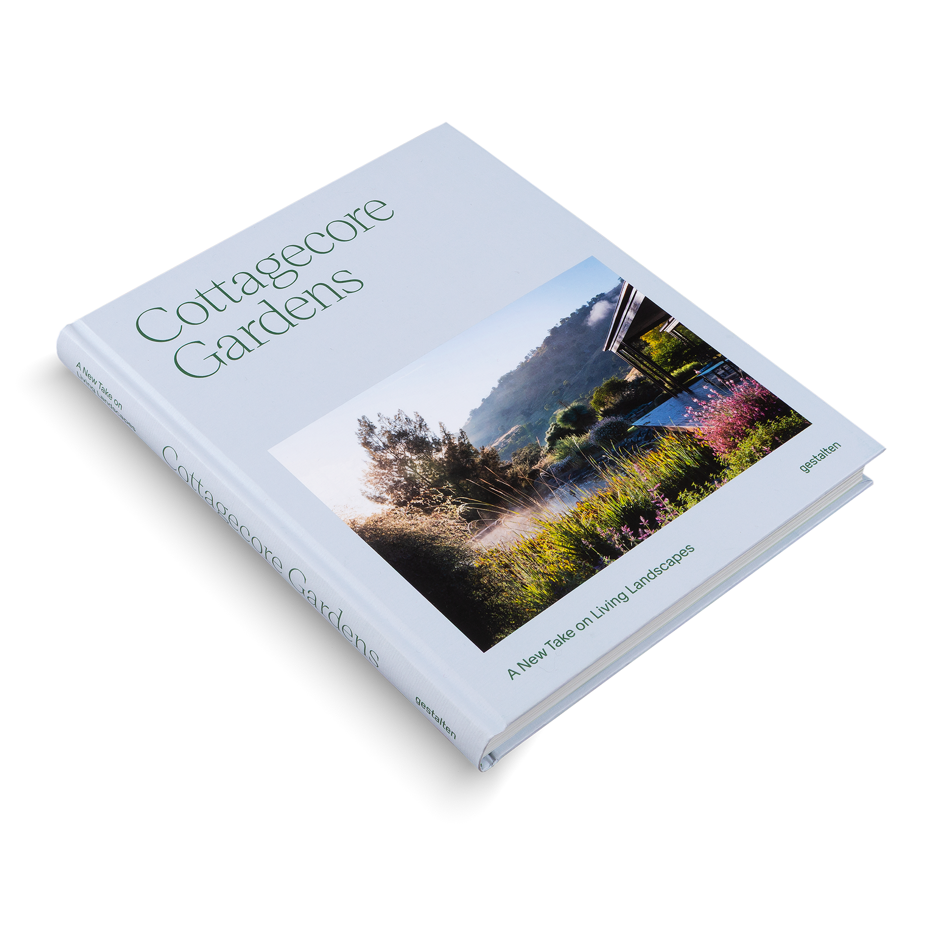 Book titled 'Cottagecore Gardens' with a cover featuring a garden scene on a light blue background
