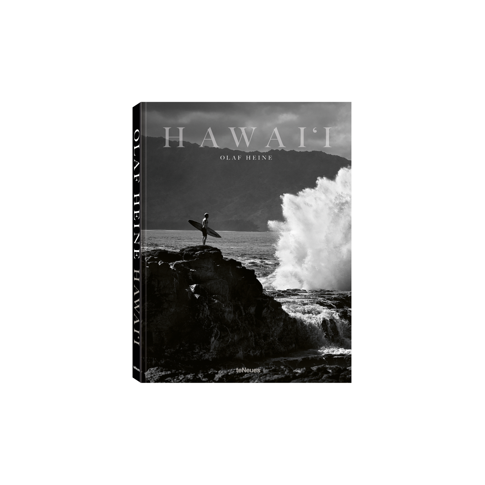 Book cover of 'Hawaii' by Olaf Heine with a surfer on a rock and crashing wave.