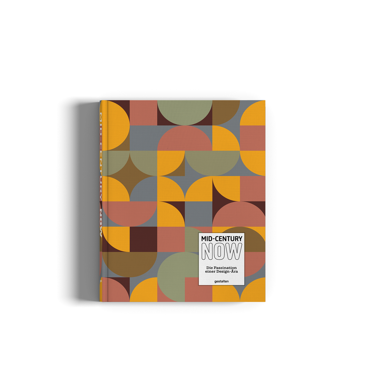 A hardcover book titled 'MID-CENTURY NOW' featuring a retro mid-century modern geometric pattern in muted orange, olive green, brown, and gray. The book is photographed on a clean white background with a soft drop shadow.
