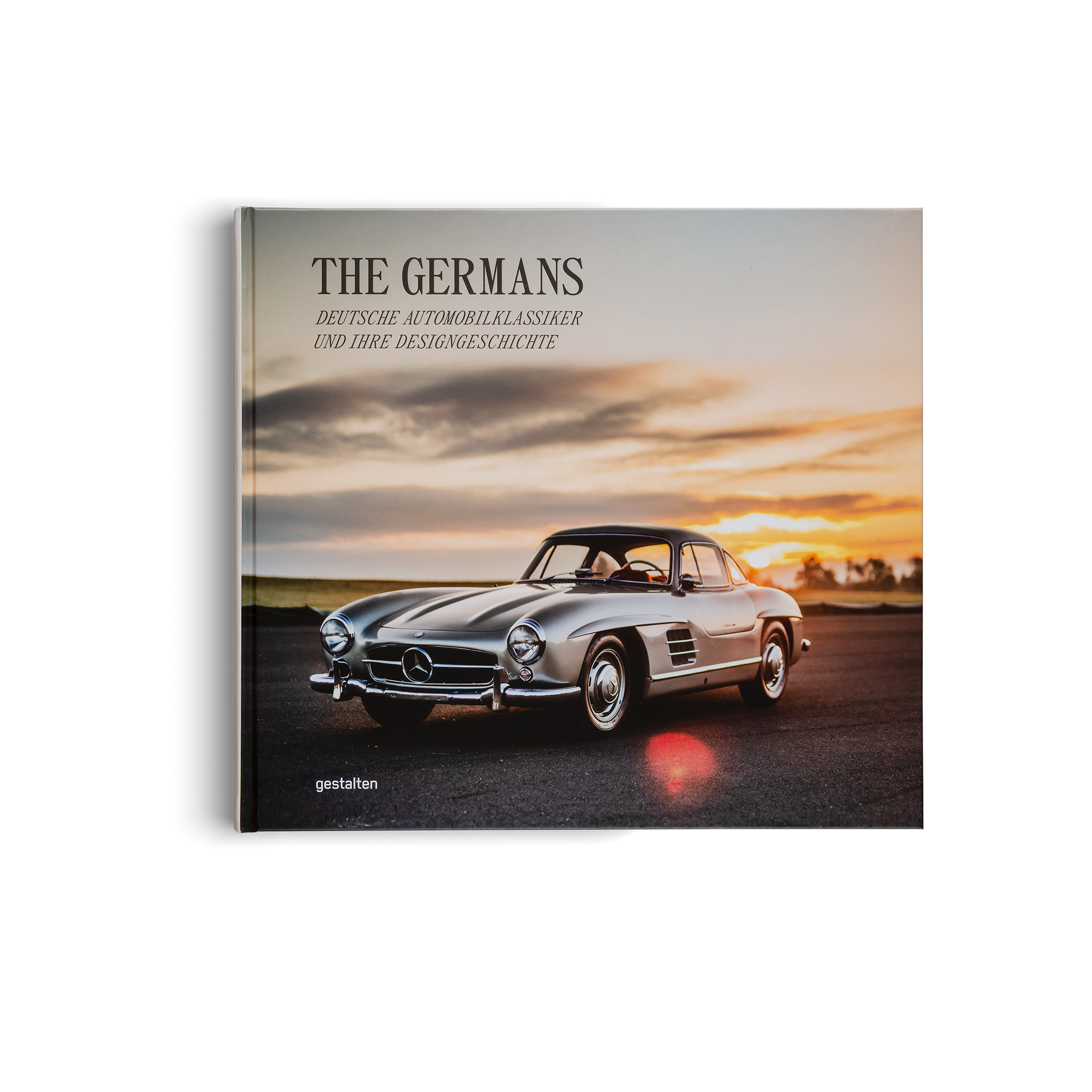 Book titled 'The Germans' featuring a classic Mercedes-Benz car on the cover.