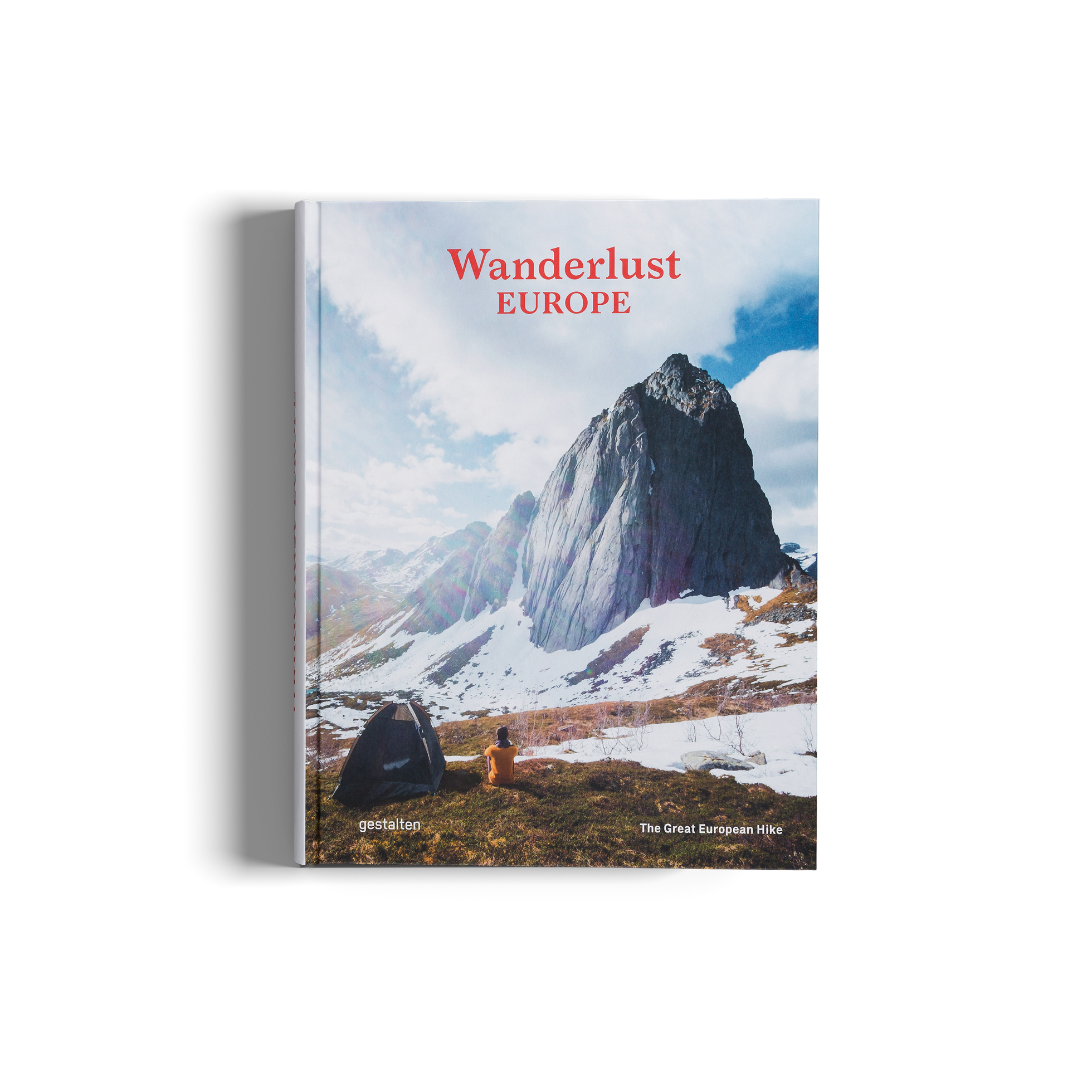 Book titled 'Wanderlust Europe' with a mountain landscape on the cover