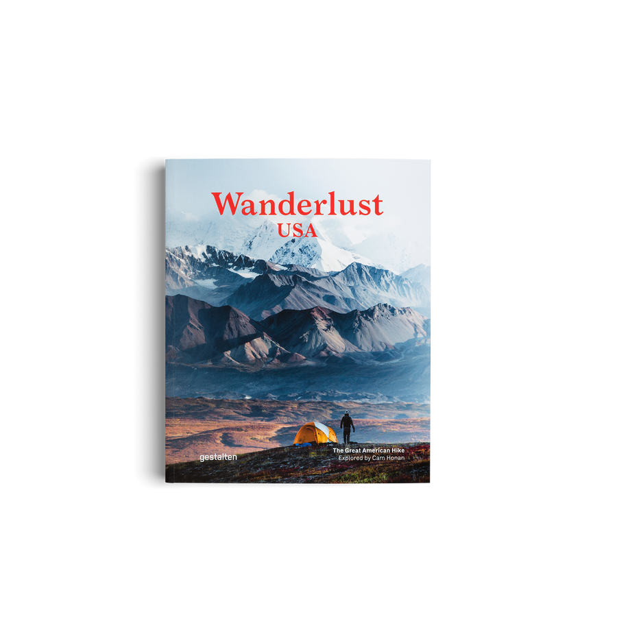 Book cover of 'Wanderlust USA' with a mountain landscape and tent on a white background