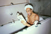 Raven Smith reading a book in his bath in How to be a Tastemaker.