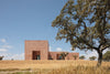 Casa Azul was directly informed by the surrounding landscape. After visiting the site in the arid Alentejo region of southern Portugal, Lisbon-based Bak Gordon Arquitectos developed a design around two “fresco” rooms that rise at either end of the largely single-story holiday home.