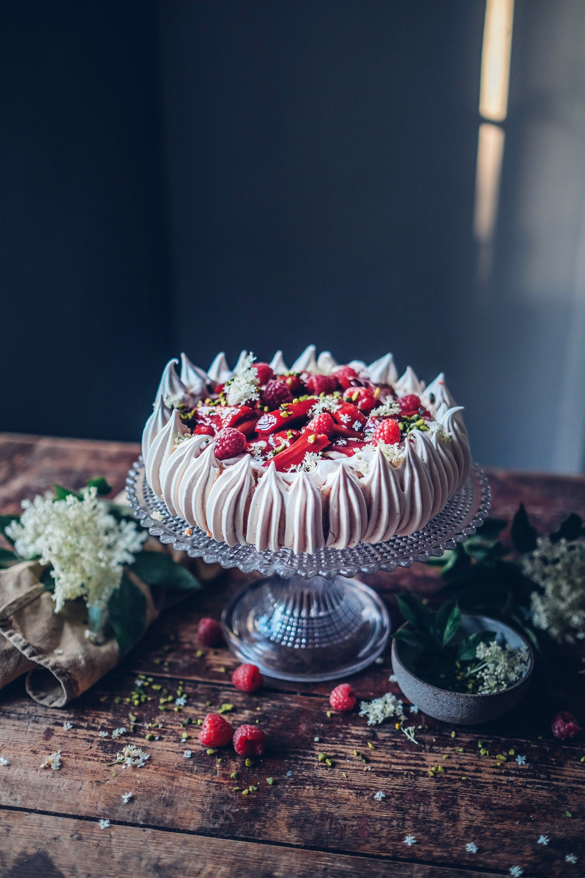 This recipe of pavlova with Poached Rhubarb and Pomegranate-Beet Syrup is featured in A Year with Our Food Stories, a gluten free cookbook.