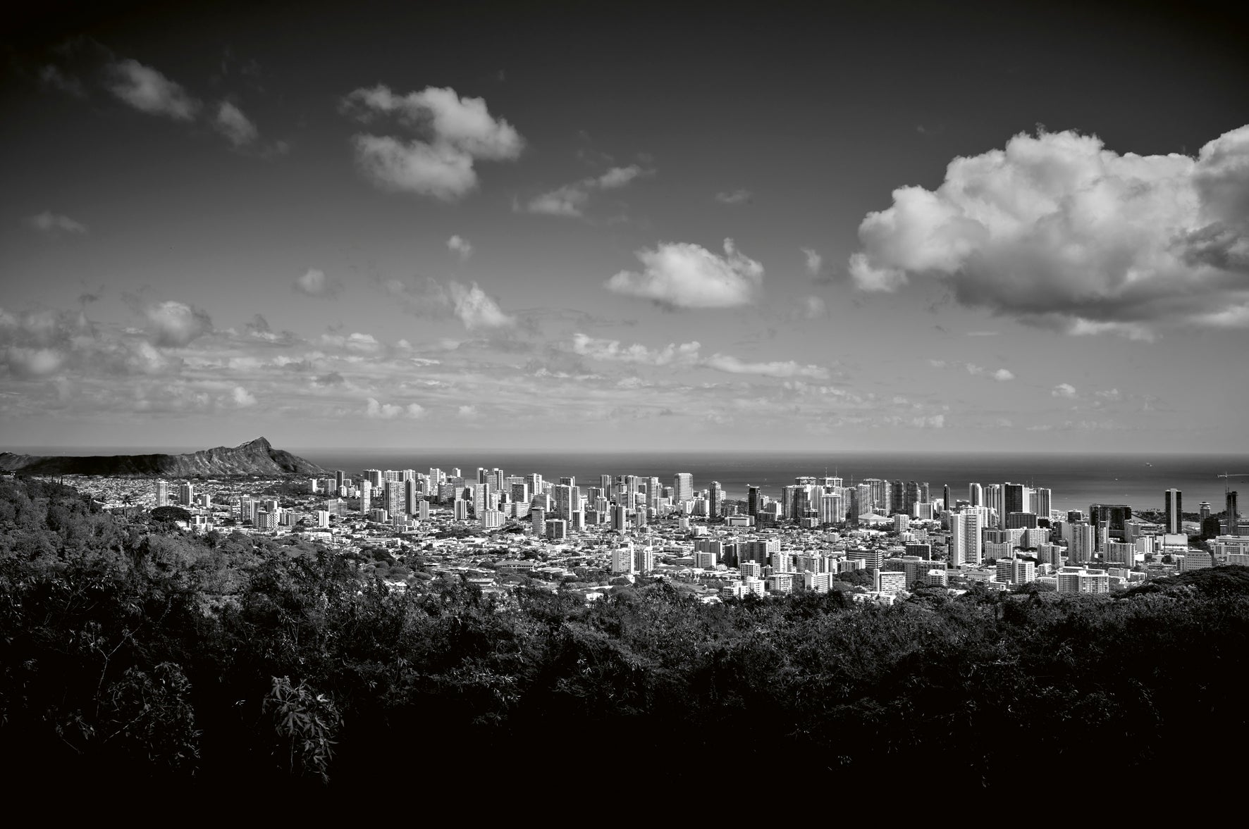 Black and white cityscape with mountains in the background
