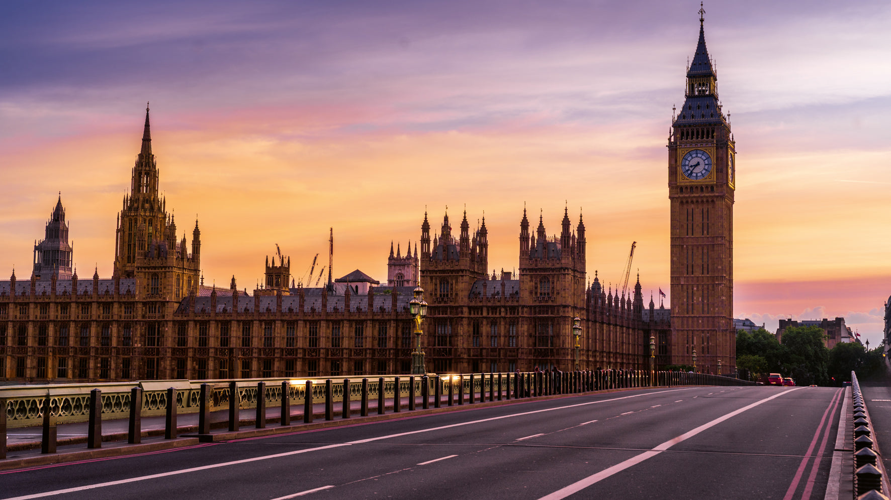 Sunset view of the London skyline with Big Ben and the Houses of Parliament.