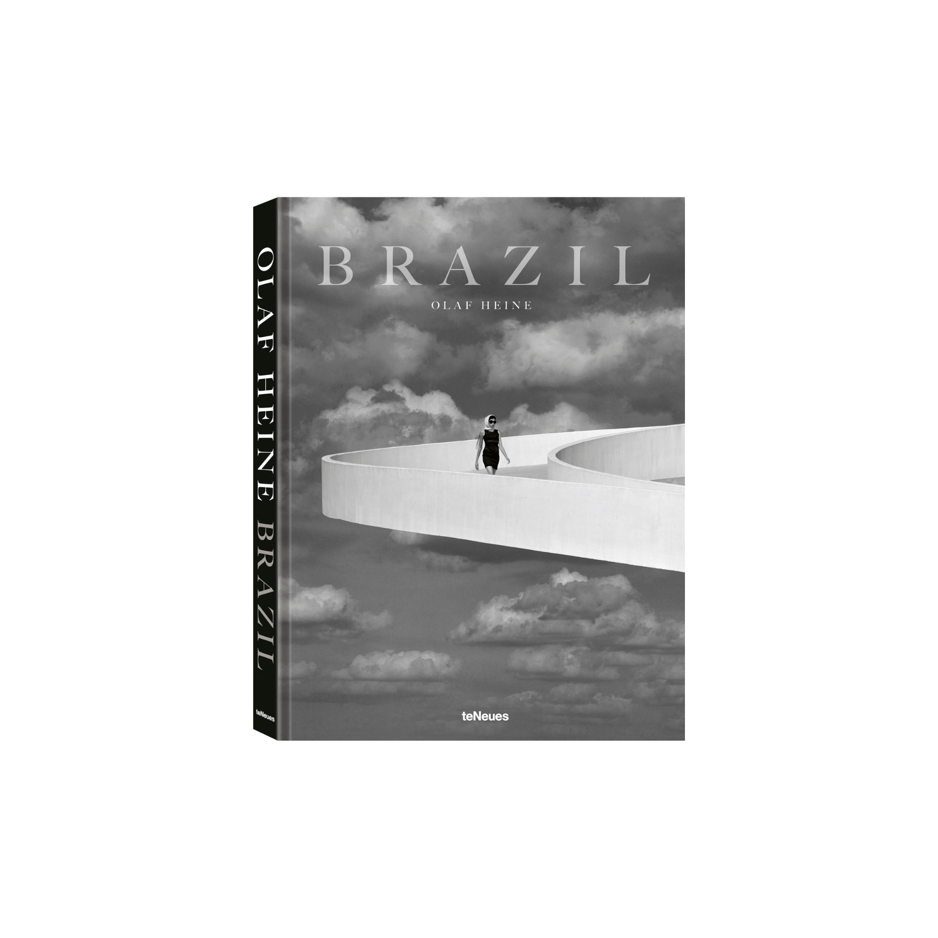 Book titled 'Brazil' by Olaf Heine with a black and white cover featuring a person on a bridge over clouds.