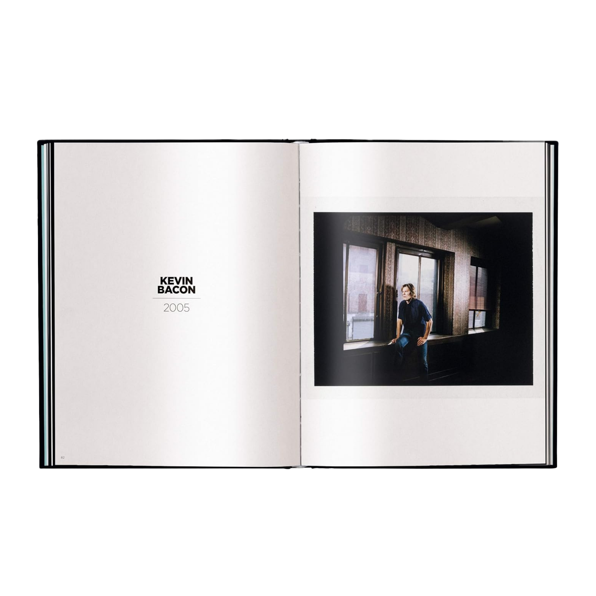 Open book showing a photo of a person sitting in a room with large windows, credited to Kevin Bacon.