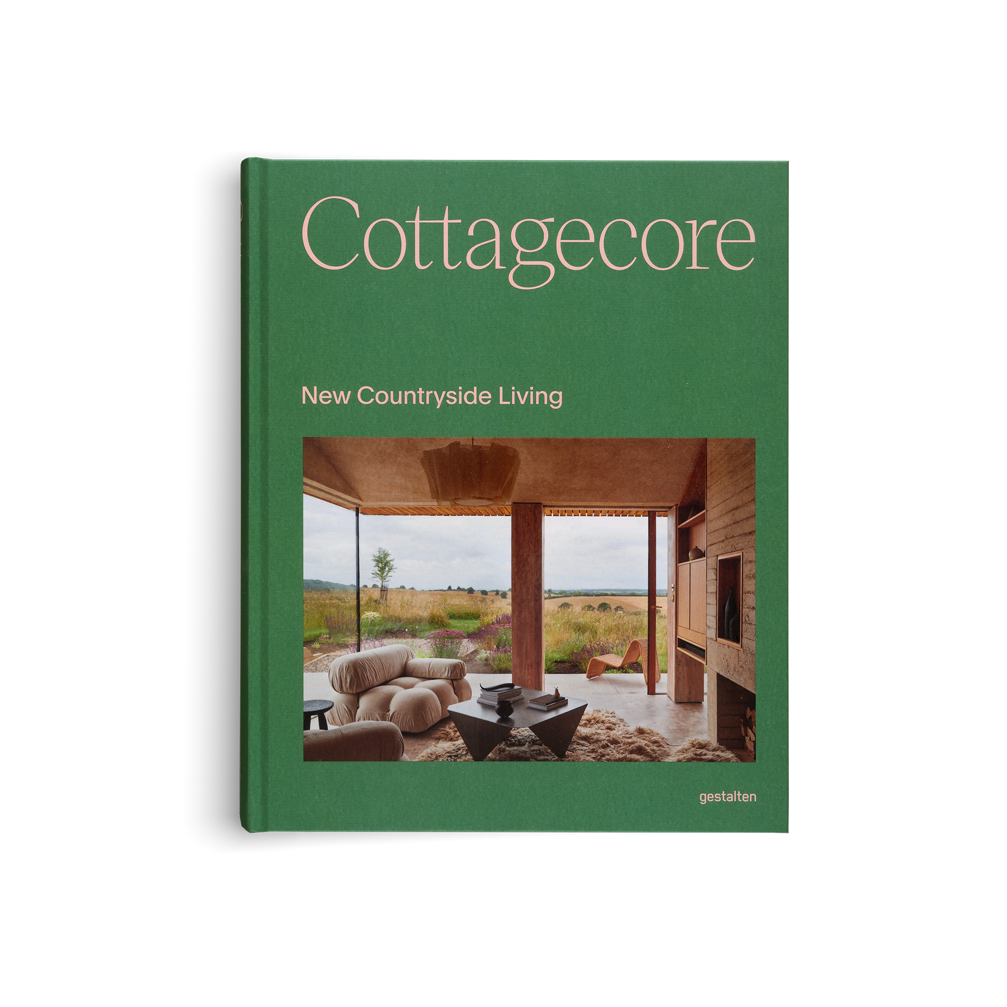 Book titled 'Cottagecore: New Countryside Living' with a green cover and interior photo.
