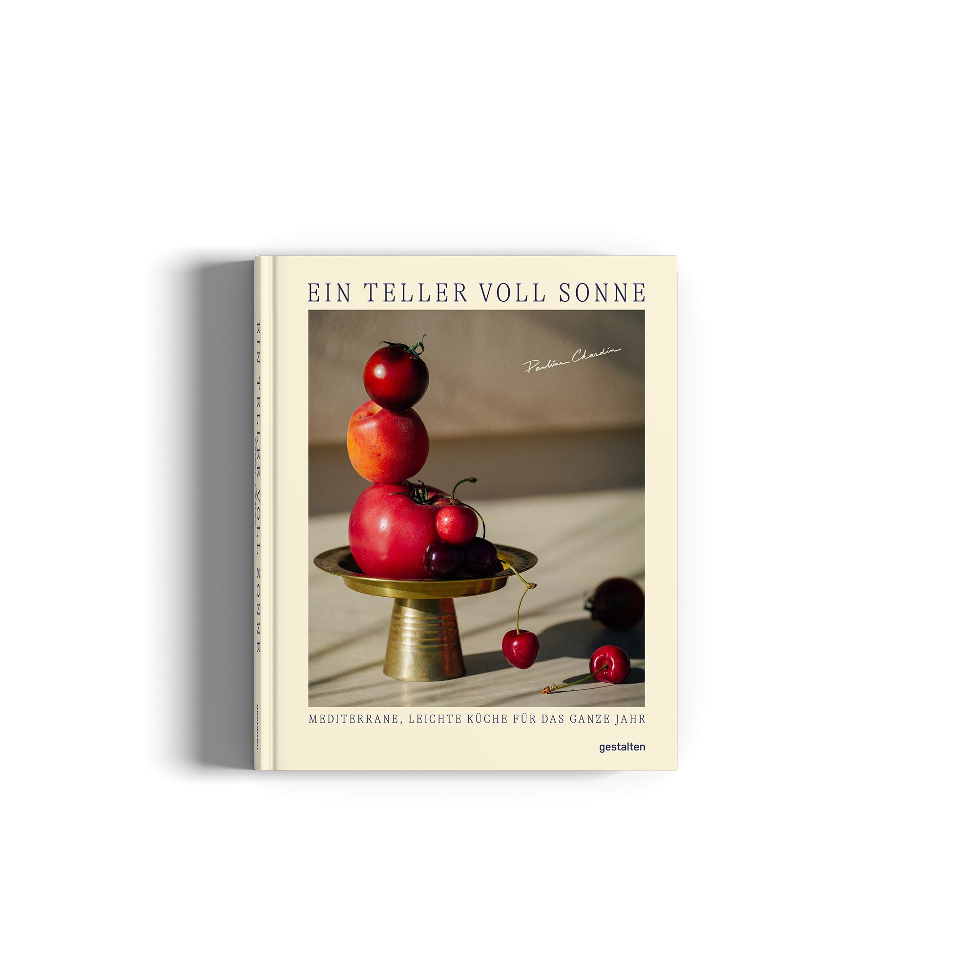 German cookbook titled 'EIN TELLER VOLL SONNE' featuring a classic still life cover with red apples and cherries on a gold pedestal, set against a beige background.