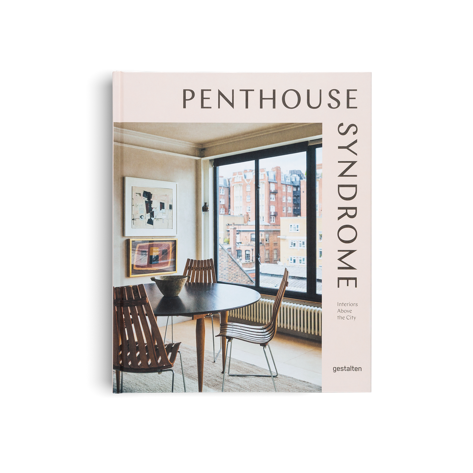 Book titled 'Penthouse Syndrome' with a dining room scene on the cover.