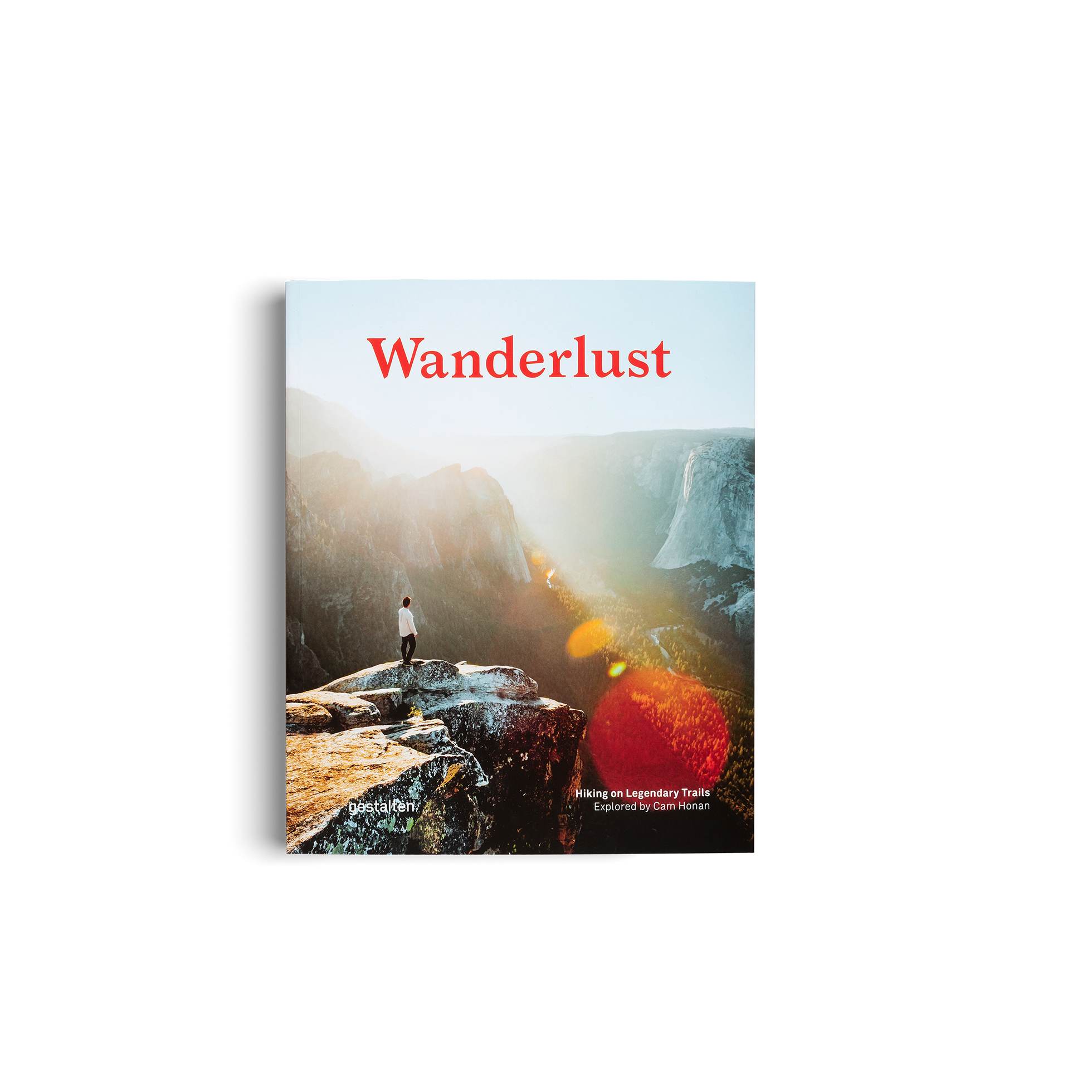 Book cover of 'Wanderlust' with a person standing on a cliff overlooking a valley.