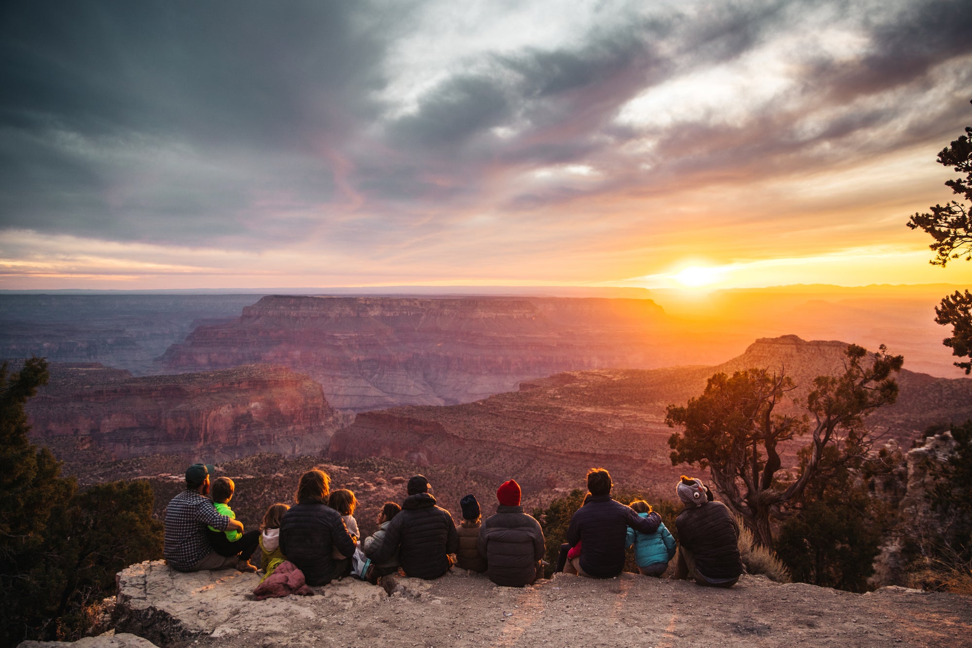 A family looking at the sunset in Family Adventures by gestalten