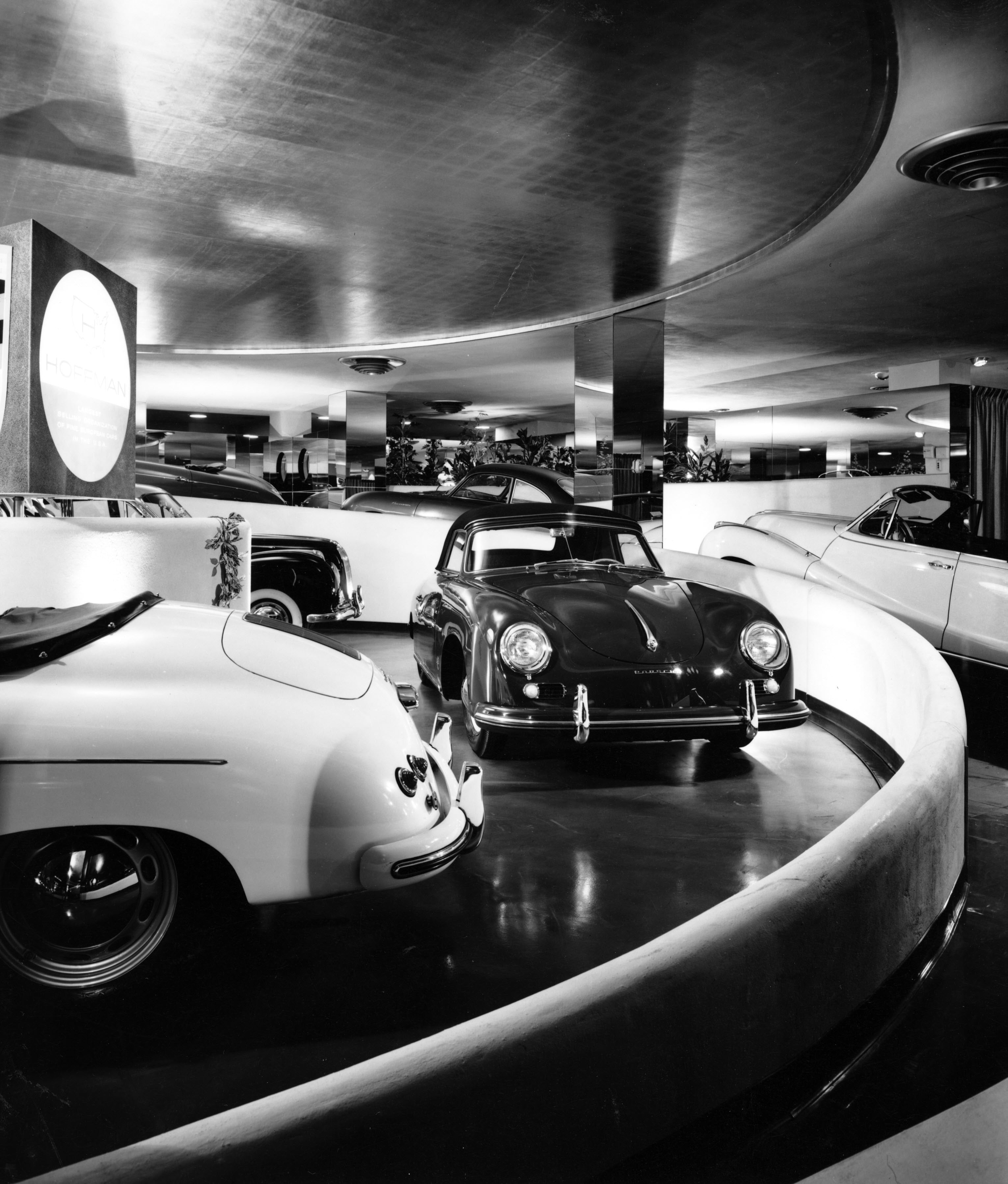 A black and white photo of a Porsche 911