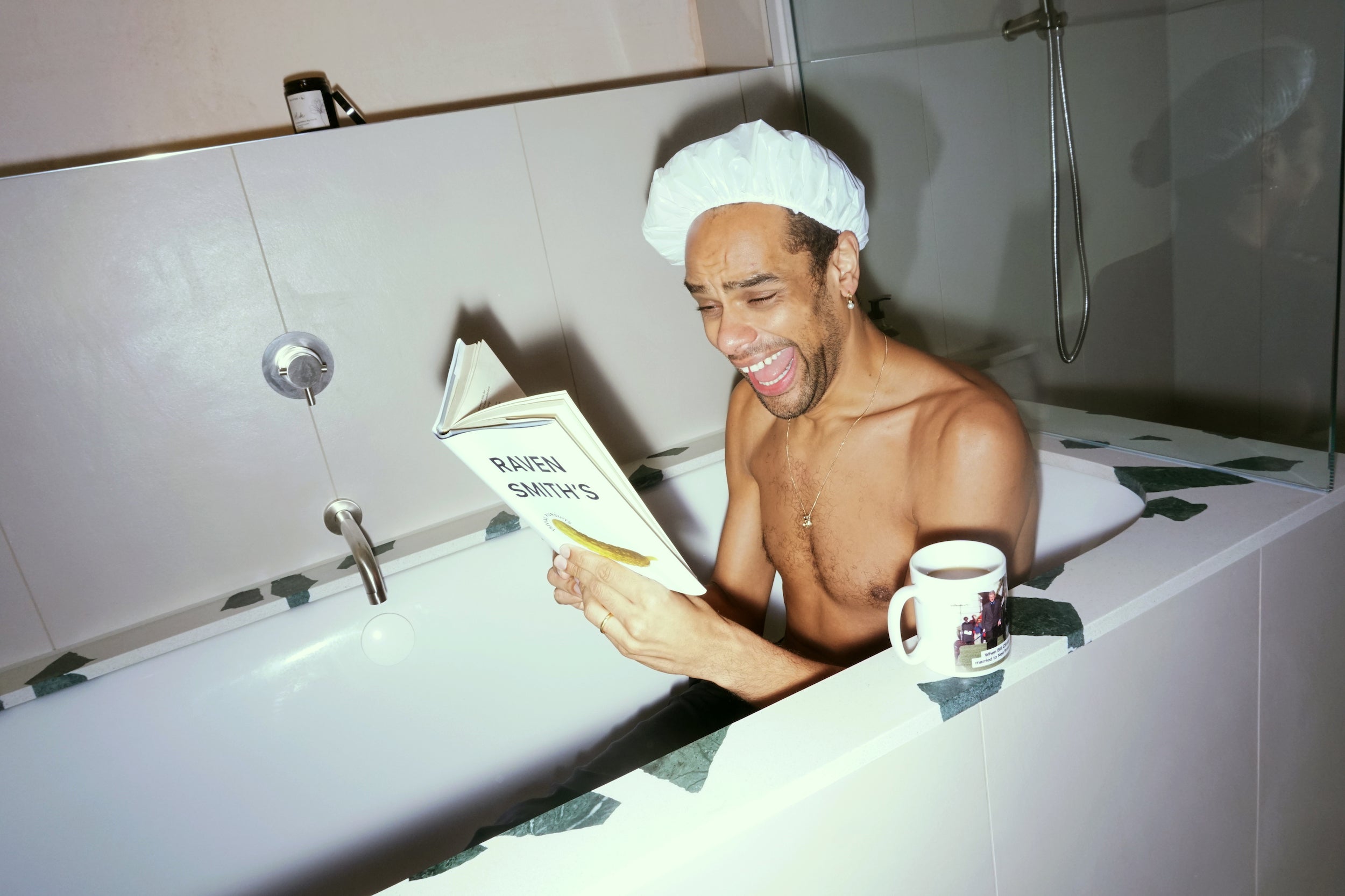 Raven Smith reading a book in his bath in How to be a Tastemaker.
