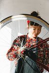 Woman is repairing a bike