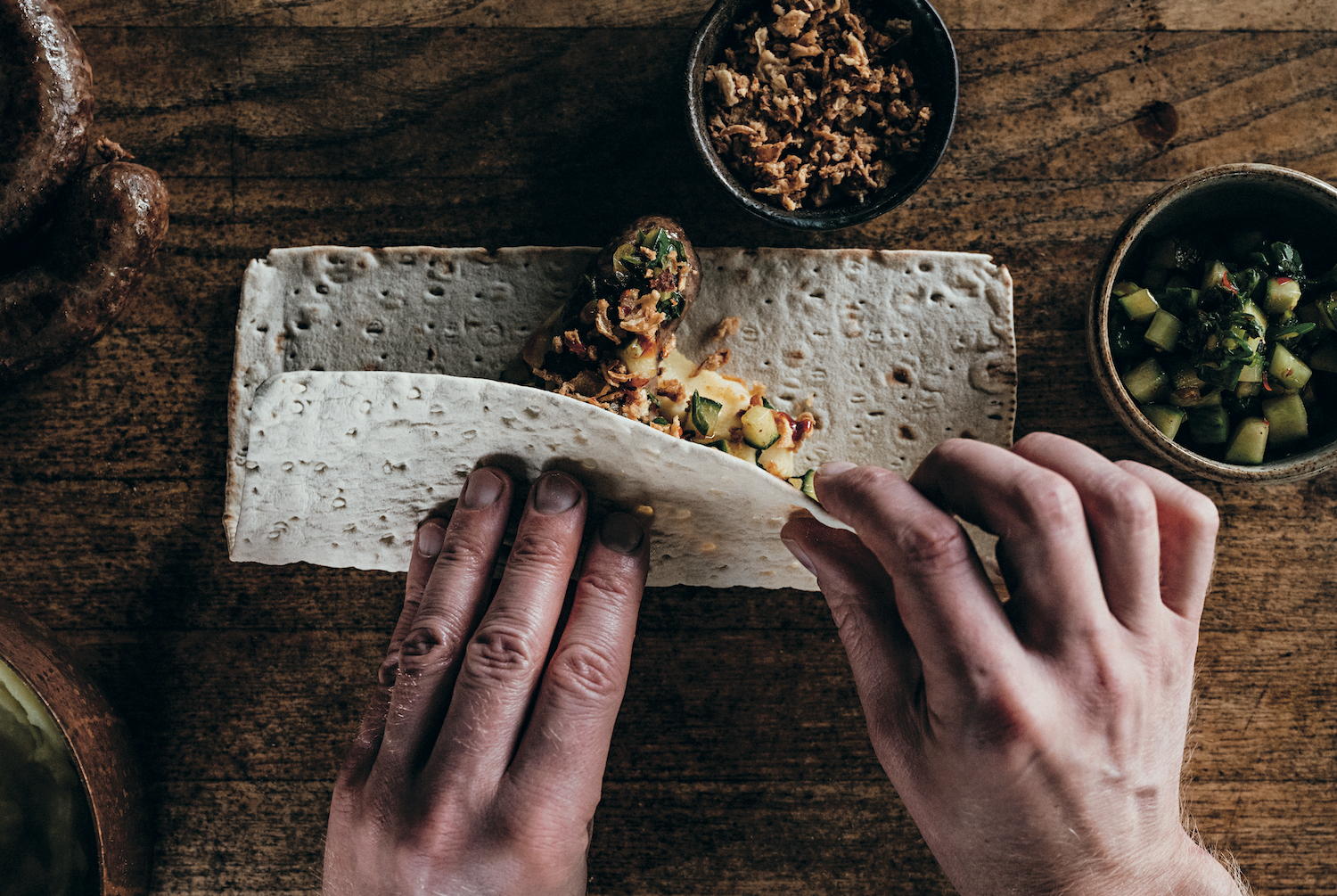 Wild boar salsiccia in flatbreads, a recipe featured in The Wild Game Cookbook.