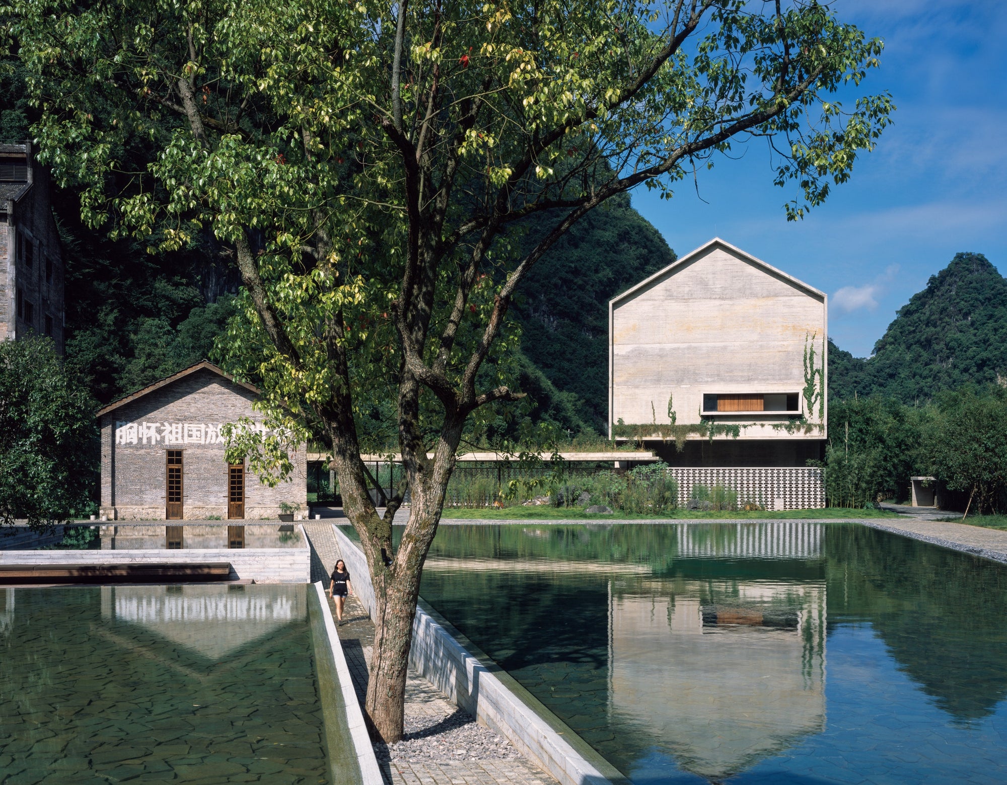 In converting an abandoned 1960s sugar mill in Guangxi to a luxury hotel, Vector Architects restored and  repurposed the site with additions consistent with the con- struction of the original buildings. Its approach to reuse is  therefore hybrid, combining rehabilitation and new build, radically adapting the previous structures. This project is featured in Building for Change by Ruth Lang and gestalten.
