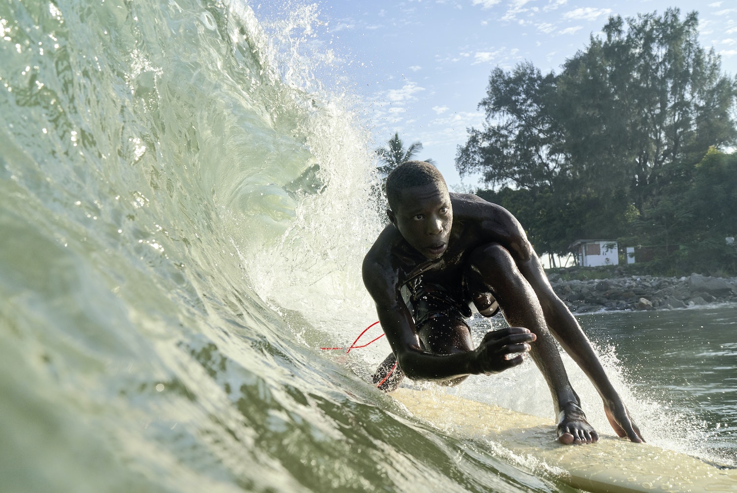 Tarkwa Bay is a small sandy strip of man-made beach located just outside the entrance of Lagos in Nigeria. There, a break wall creates perfect wedges. This accidental gift from the city’s civil engineers has spawned a lively surf scene. At its center are John Micheletti, an Italian who was born and raised in Nigeria, and Godpower Pekipuma, a Tarkwa local through and through. Discover this amazing surfing spot in The Surf Atlas by Luke Gartside